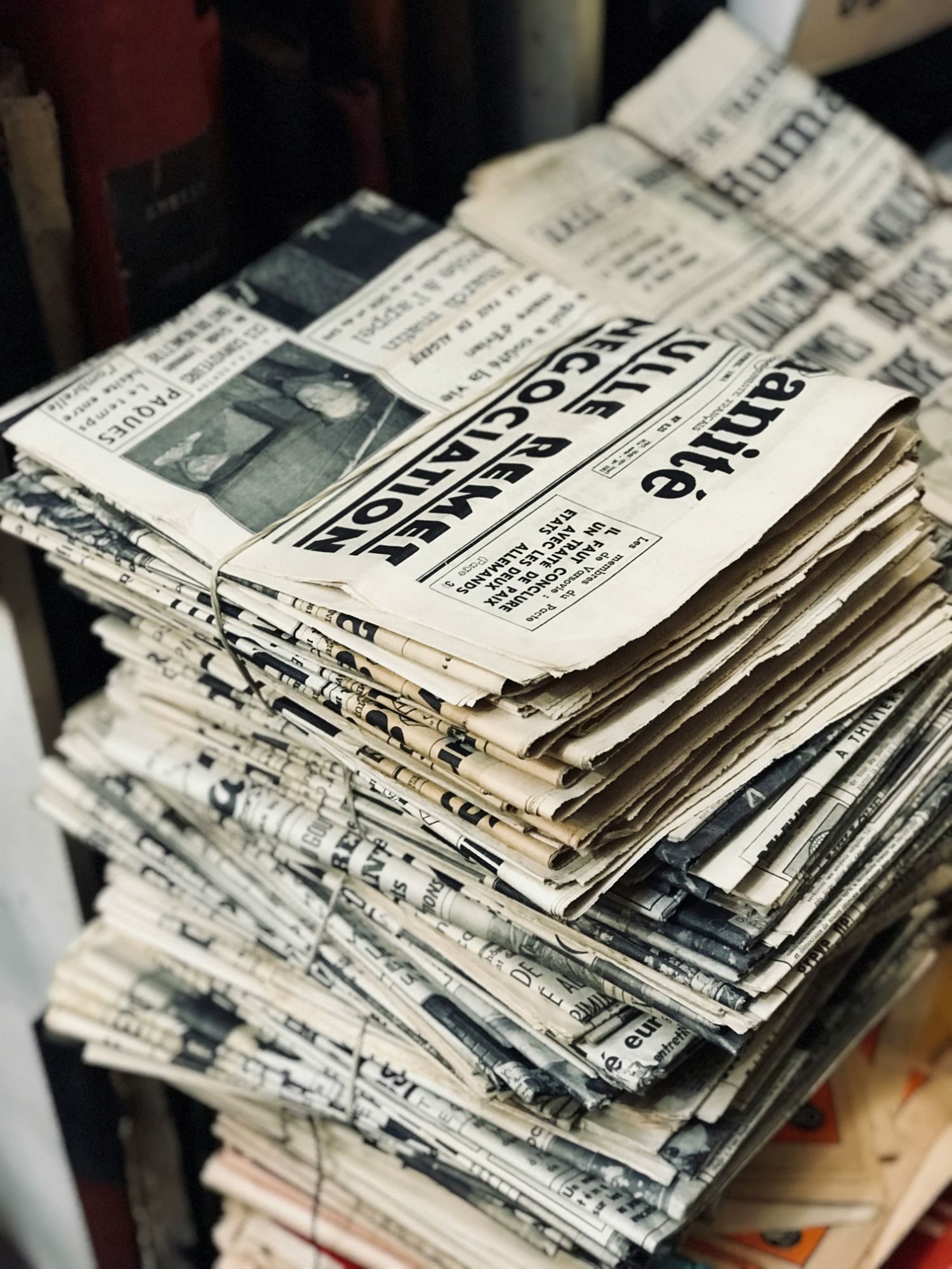 A stack of old newspapers tied with string